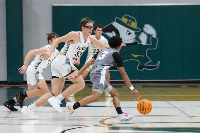 Bishop McNamara's Callaghan O'Connor defends during the Fightin' Irish's 70-51 loss to Hope Academy on Tuesday, Dec. 9, 2025
