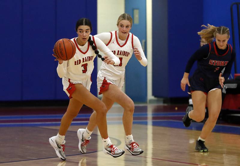 Huntley’s Cassidy Serpe (left) pushes the ball up the court as her teammate, Huntley’s Anna Campanelli, and South Elgin’s Addison Tinerella follow on Tuesday, Nov. 21, 2023, during a basketball game in the Dundee-Crown High School Girls Thanksgiving Tournament in Carpentersville.