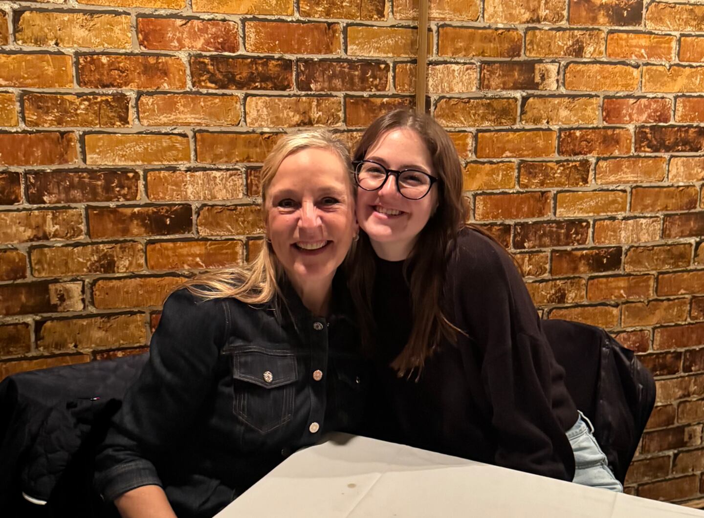 Princeton High School senior Morgan Bartkiewicz (right) received a $15,000 scholarship from Deborah Knuff (left) and a group of "Chicago Moms."