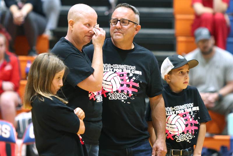 Becky Cleveland and her family are recognized as the guests of honor before the Genoa- Kingston volleyball team's Volley for the Cure breast cancer fundraiser match against Oregon Wednesday, Sept. 21, 2022, at Genoa-Kingston High School. Cleveland, a former student and teacher at Genoa-Kingston High School is currently battling cancer.