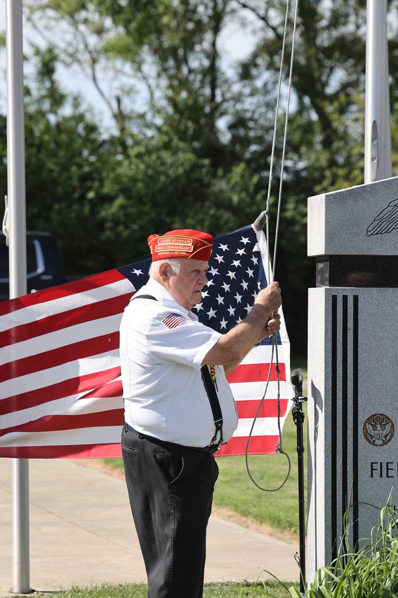 David Allen, of the Marine Corps League Detachment 1253, raises the flag during a ceremony dedicated to the late John Kirnbauer, a veteran whose ashes went unclaimed for five years, on Monday, May 26, 2025, at Kankakee Memorial Gardens.