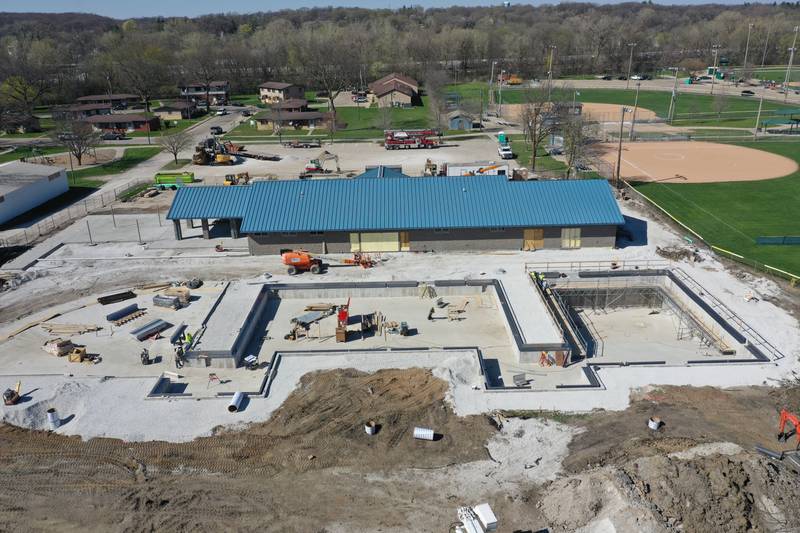 Workers from Helm Group continue to make progress on the Riordan Pool construction on Thursday, April 13, 2023 in Ottawa. The 6.7 million dollar pool will feature a 5,700 square foot bather preparation facility with offices, locker rooms, private family changing rooms, public washrooms with showers along with a 9,500 square foot pool. The facility includes a zero-depth entry, a six-lane 75 foot competition lap pool and a diving area with three diving stands. Also included is a covered shelter with picnic tables, vending machines and tables with umbrellas. The new Riordan Pool is on track to open Memorial Day Weekend.