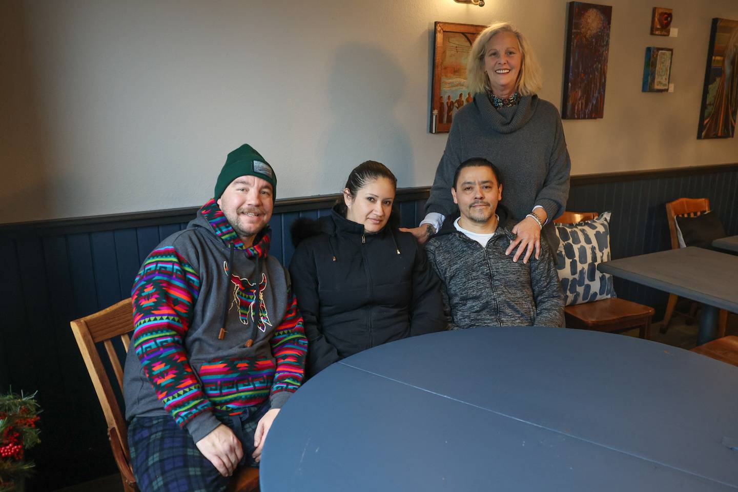 Meg Gillespie, standing, owner of Magpie's Joy of Eating was able to retain the Thayer Brothers kitchen crew jay Beshoar, left, Jessica Cano and Erick Larios.