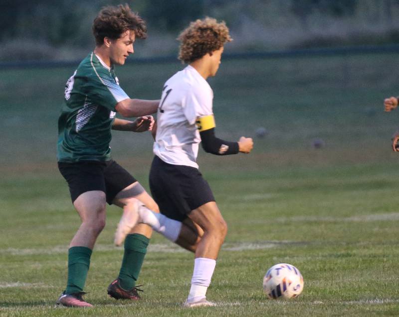 St. Bede's Sean Brayton defends as Abingdon-Avon's Kolbe Hightower races to the ball on Wednesday, Oct. 15, 2025 at St. Bede Academy.
