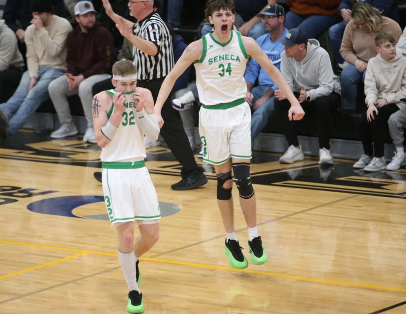 Seneca's Paxton Giertz and teammate Grant Siegel react after defeating Marquette during the Tri-County Conference championship on Friday, Jan. 31, 2025 at Putnam County High School.