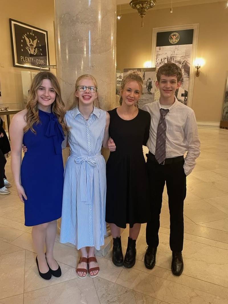 Princeton Christian Academy's Lydia Hardy (from left), Annalise Baker, Brooke Claussen and Nolan Claussen took part of the wreath laying ceremony at the Tomb of the Unknown Soldier at Arlington National Cemetery on Thursday.