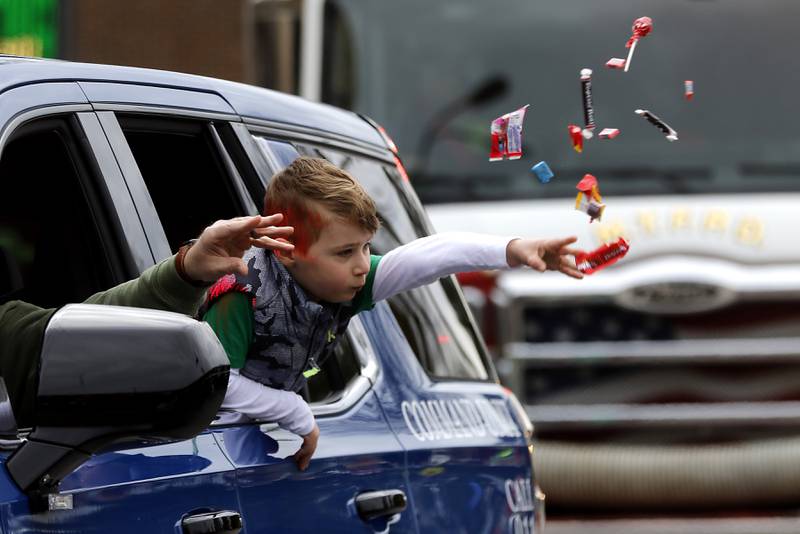 Candy is tossed during the McHenry ShamROCKS the Fox Festival Parade on Saturday, March 16, 2024.