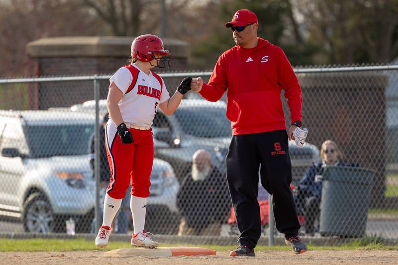 Alexcia Middleton (6) of Streator fist-pumps coach whilst on first base on Wednesday, April 16, 2025 at Streator High School in Streator.