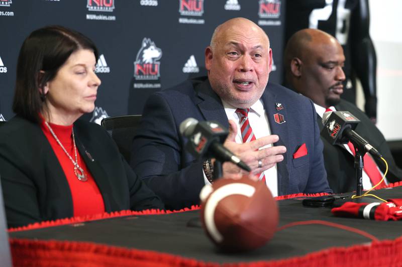 Northern Illinois University vice president and director of athletics and recreation Sean Frazier answers a question during a press conference Tuesday, Jan. 7, 2025, announcing that NIU football will be joining the Mountain West Conference starting with the 2026 season. Frazier is seated between NIU president Lisa Freeman and head football coach Thomas Hammock.