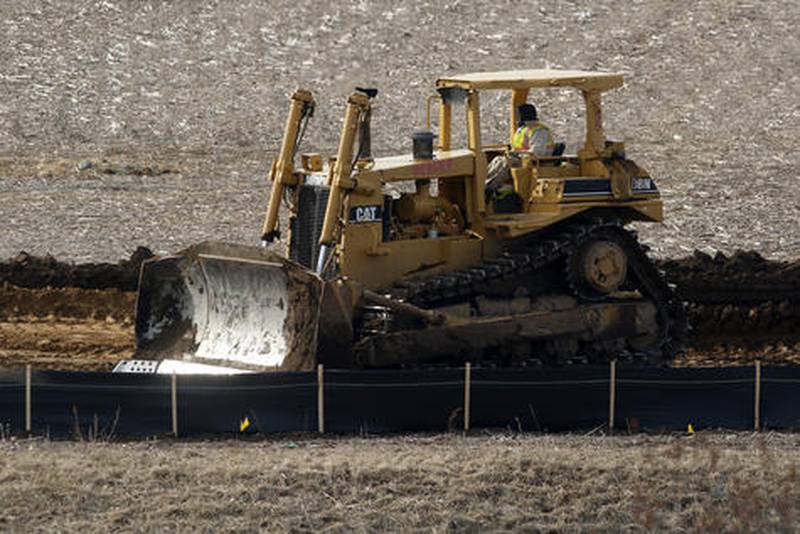 Construction vehicles work on the site of the future Mercyhealth hospital at the intersection of Three Oaks Road and Rt. 31 on March 21, 2018, in Crystal Lake.