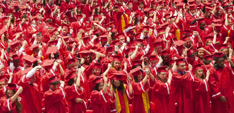 After officially receiving their diplomas, graduate move their tassels to the left of their mortarboards during Yorkville High School's class of 2022 graduation ceremony at the NIU Convocation Center on Friday, May 20, 2022.