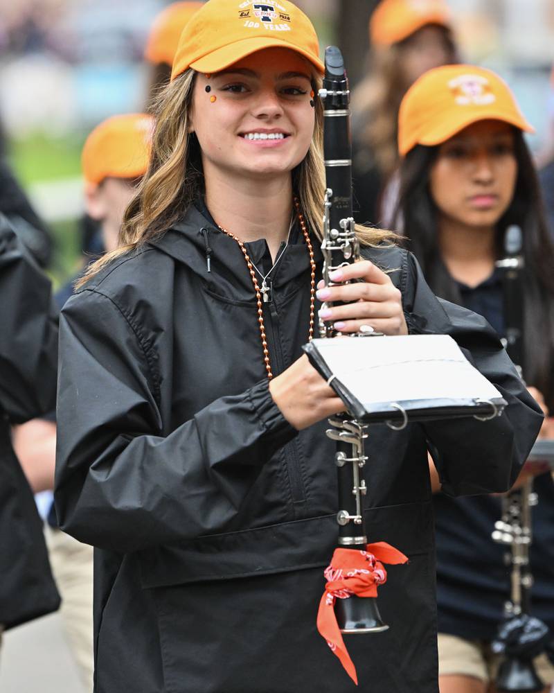 A member of the Crystal Lake Central High School's Marching Tiger Band seen at the start of their school's 100 year anniversary homecoming day parade on Saturday, Sep. 16, 2023 in Crystal Lake. The parade began at the high school and made its way through downtown Crystal Lake.