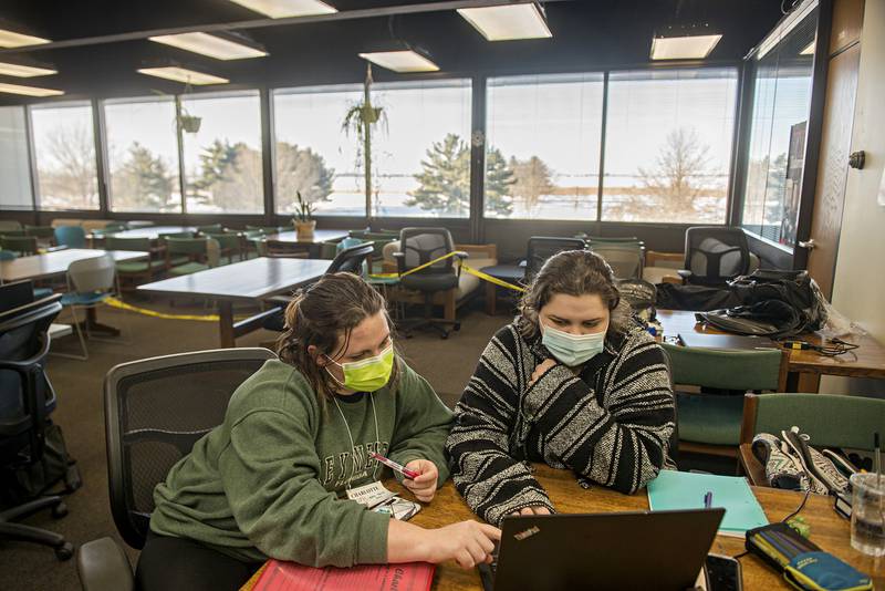 Charlotte McCoy (left) of Dixon and Kelly Rockhold of Sterling study statistics Wednesday, Jan. 26, 2022 in the library at Sauk Valley Community College. The school has seen an increase in enrollment.