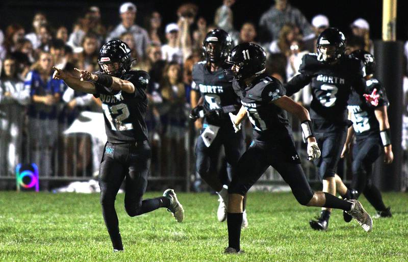 Woodstock North’s Landan Creighton and the Thunder rumble back to the sidelines after Creighton cruised for a 96-yard touchdown run against Woodstock in varsity football at Woodstock North Friday night.