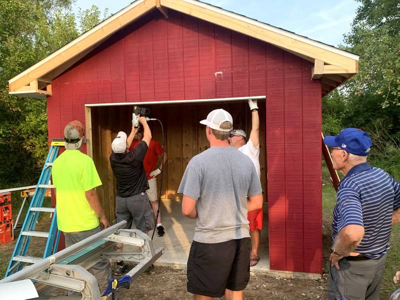 Volunteers work with Sugar Grove resident Christopher Eby to replace a dilapidated shed for the Sugar Grove United Methodist Church (SGUMC). The project was Eby’s his Eagle Project for Sugar Grove Boys Scouts of America Troop No. 41.