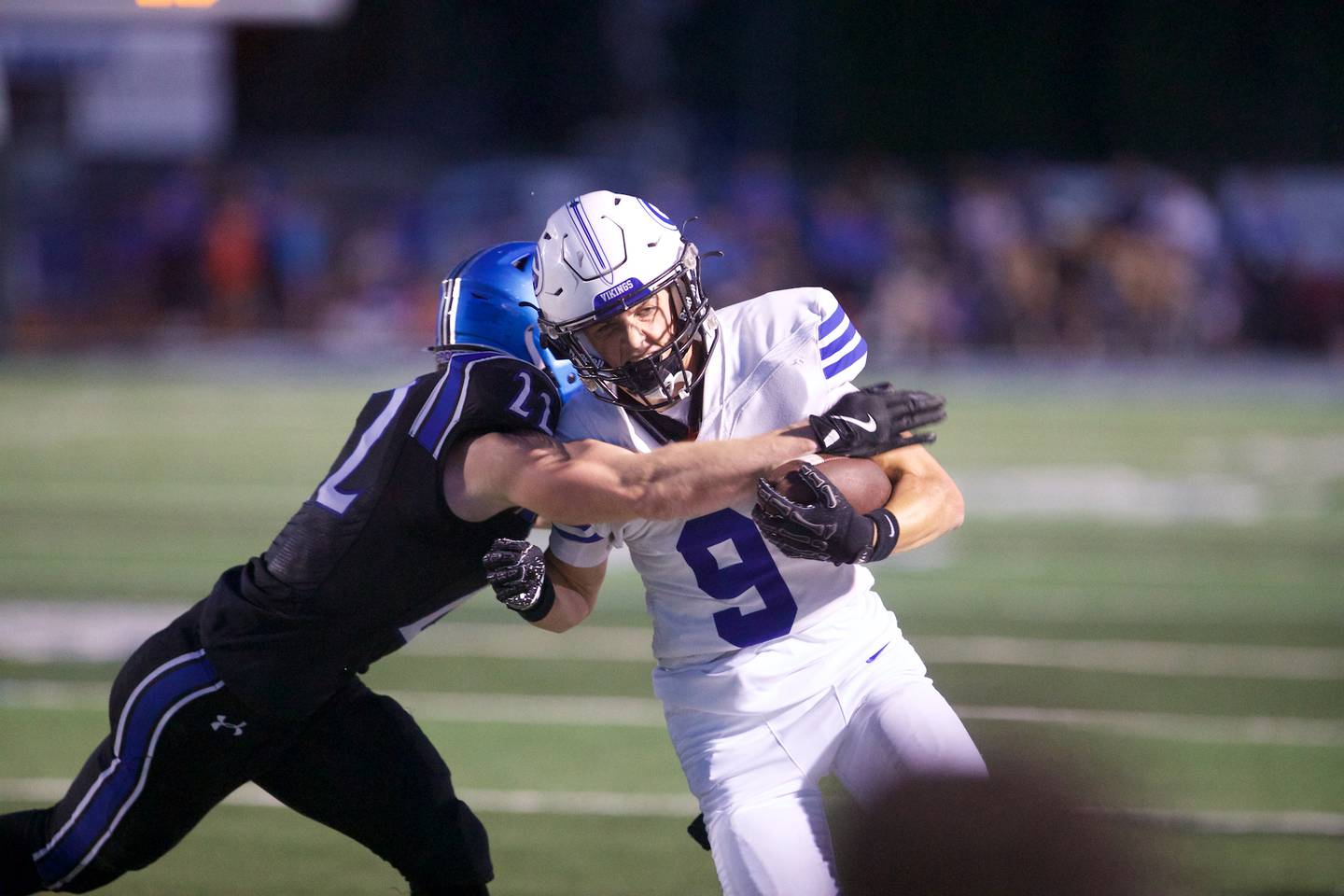 Geneva's Tate Beran is tackled by St. Charles North's Josh Wilkerson on Sept. 12, 2025 in St. Charles.