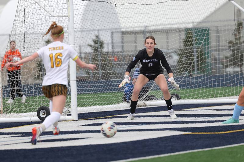 Plainfield South’s Hannah Folliard readies at the net against Joliet West’s Abigail Vugteveen on Thursday, April 18, 2024.