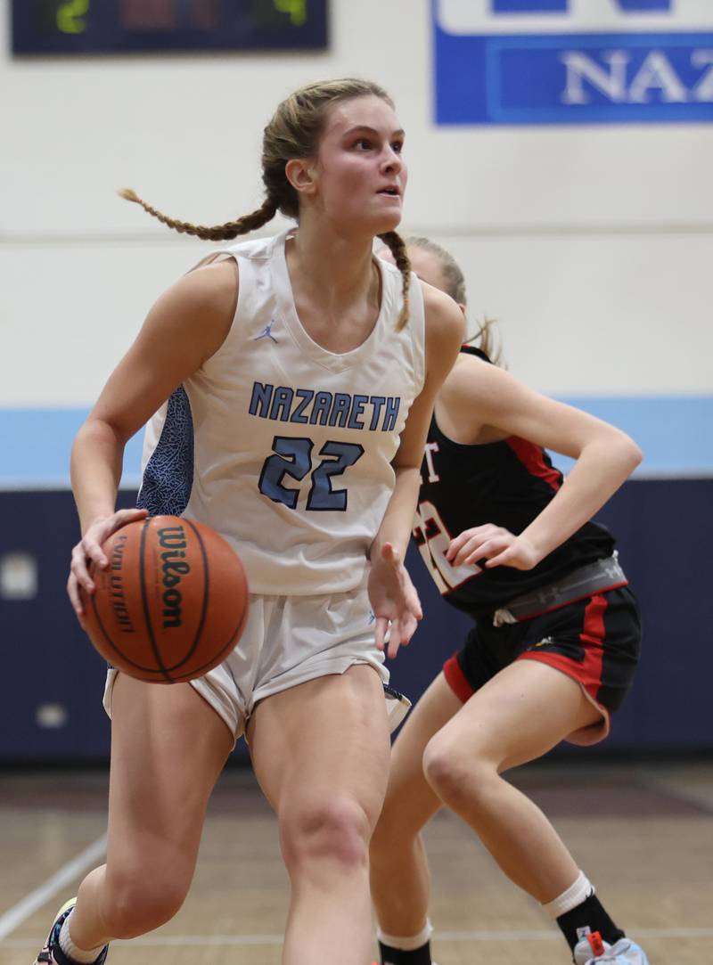 Nazareth's Gracie Carstensen (22) drives to the basket during the girls varsity basketball game between Benet and Nazareth academies on Wednesday, Jan. 3, 2023 in La Grange Park, IL.