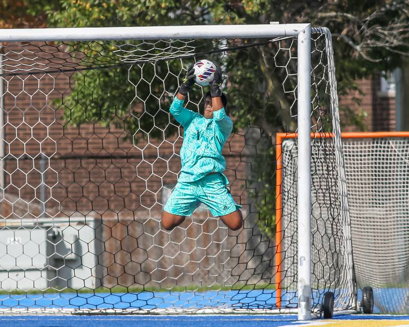 Downers Grove North's Adi Zaveri1 (1) makes a save during Class 3A Lyons Regional final soccer match.  Oct 21, 2023.