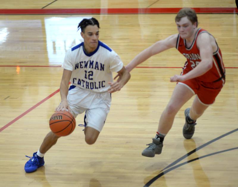 Newman's Isaiah Willams dribbles against Orion on Saturday, Dec. 20, 2023 at the Warkins Memorial Tournament at Erie High School.