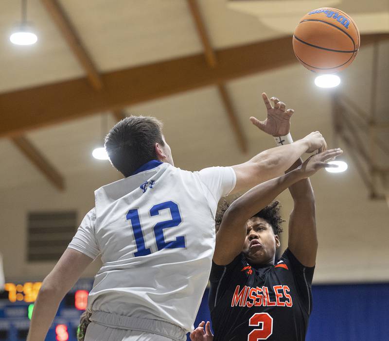Milledgeville’s Micah Toms-Smith and Newman’s Cody McBride fight for a rebound Monday, Feb. 24, 2025, during a Class 1A Regional quarterfinal at Newman High School.