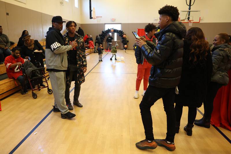 Jeremiah Fears (right) takes a photo his brother Jeremy Fears Jr. with a guest at the Salvation Army Community Center. Friends and family host a reception for Joliet West’s basketball player Jeremy Fears Jr. before he heads to Houston to play in the All-McDonalds game.