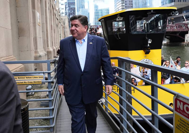Illinois Governor JB Pritzker gets out from a Chicago water taxi after a news conference, Monday, Aug. 25, 2025, in Chicago. (AP Photo/Nam Y. Huh)