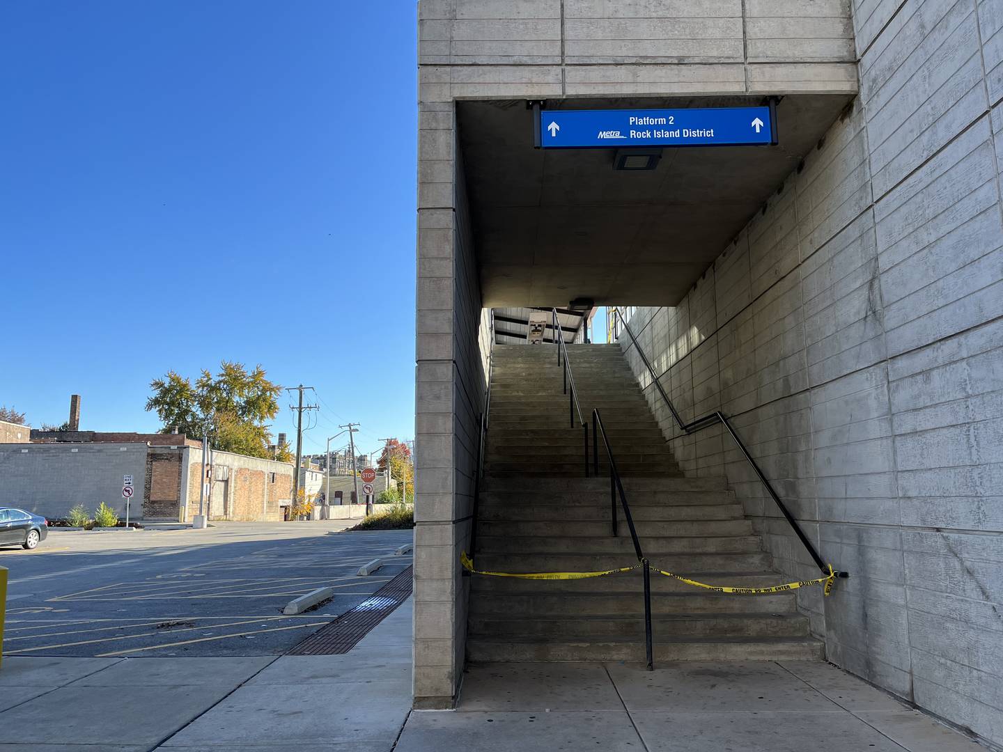 An entrance at the Rock Island train platform was taped off on Wednesday, Oct. 26, 2022. A pedestrian was struck by a freight train and died. Train services in Joliet were temporarily suspended.