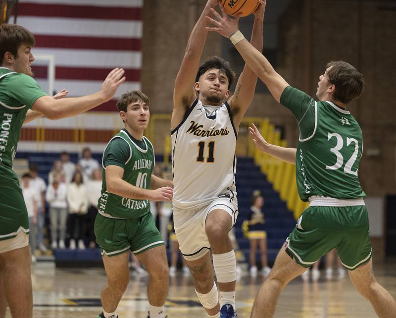 Sterling’s Nico Battaglia drives the lane against Alleman Friday, Dec. 20, 2024, at Sterling High School.