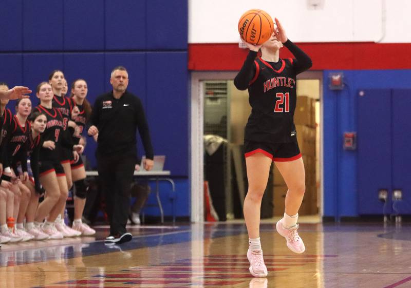 Huntley’s Luca Garlin drains a half-court shot to conclude the first quarter against Maine South in Komaromy Holiday Classic varsity girls basketball championship game action on Monday, Dec. 30, 2024, at Dundee-Crown High School in Carpentersville.