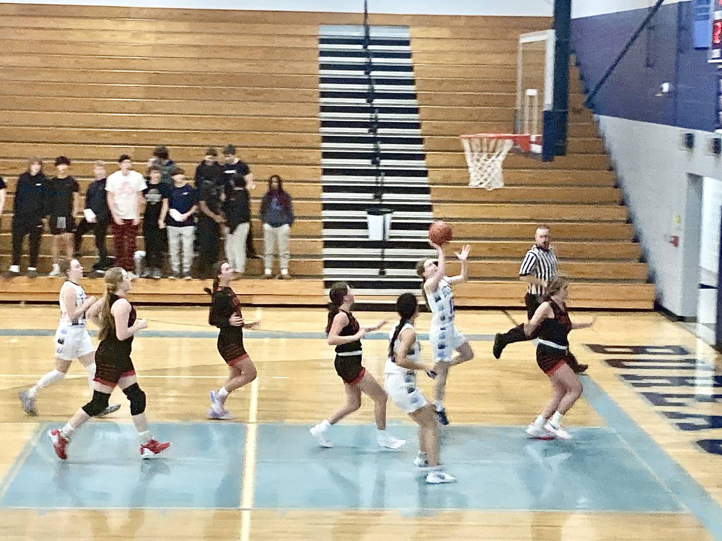 BV junior Taylor Neuhalfen shoots for two for the Storm against Hall Monday night at the Storm Cellar. The Storm won 60-50.