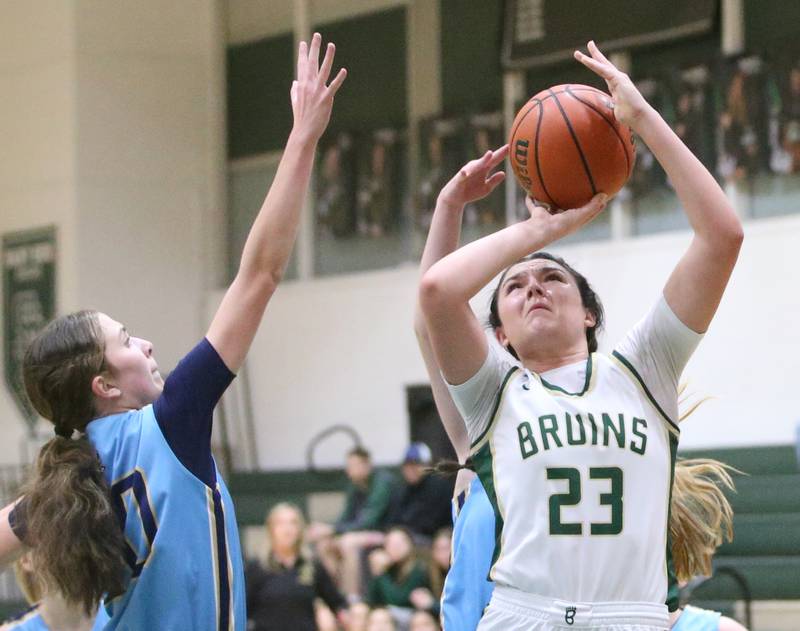 St. Bede's Ali Bosnich eyes the hoop while running in the lane past Marquette's Kaitlyn Davis on Monday, Jan. 8, 2024 at St Bede Academy.