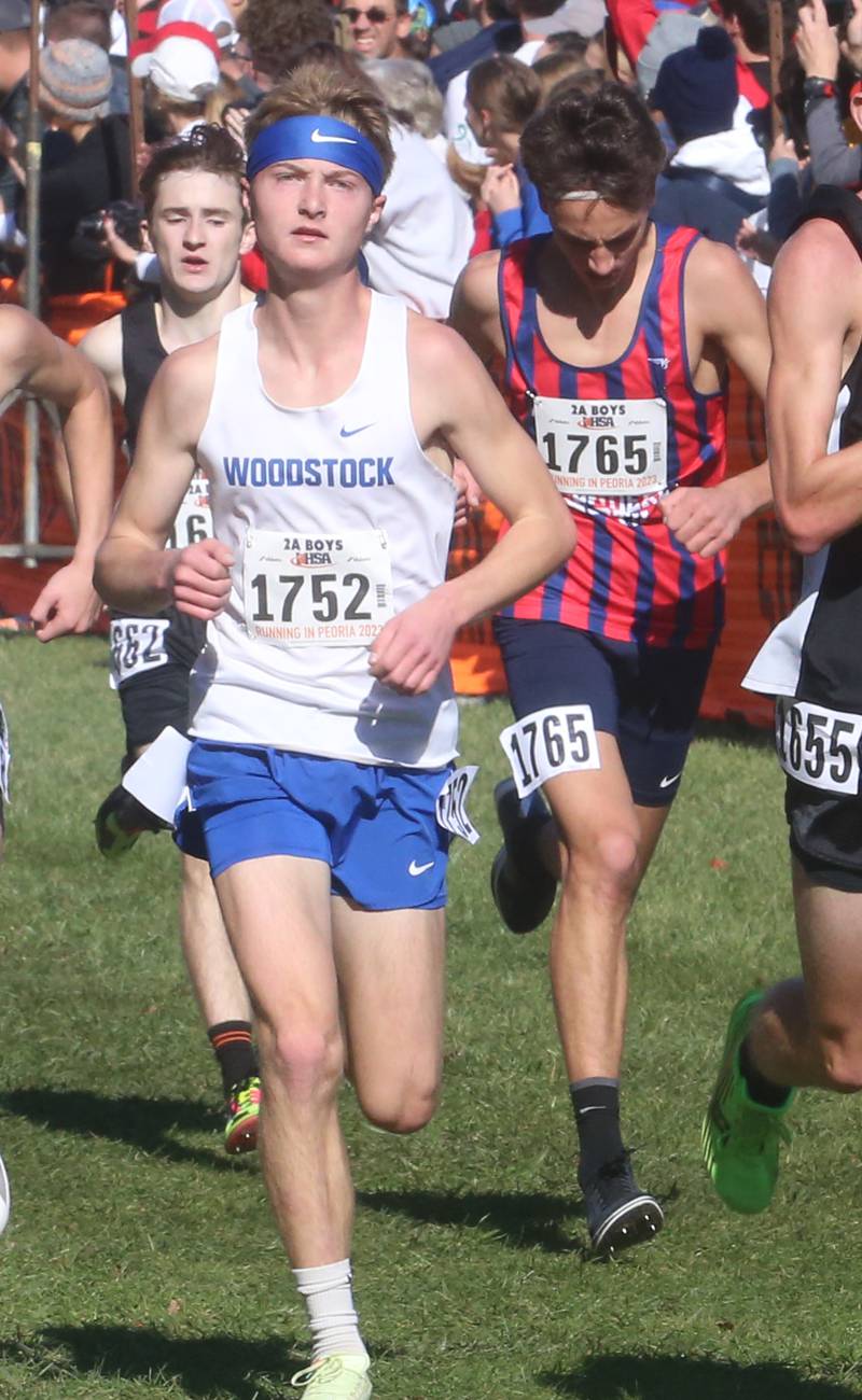Woodstock's Charlie Baker competes in the Class 2A State Cross Country race on Saturday, Nov. 4, 2023 at Detweiller Park in Peoria.