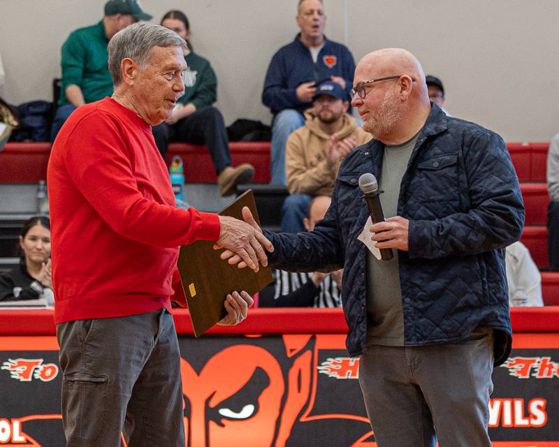 Gary Carruthers shakes hand of Jimmy Thompson as he's inducted into the 2026 Hall High School Hall of Fame on Saturday, January 31, 2026 at Hall High School in Spring Valley.