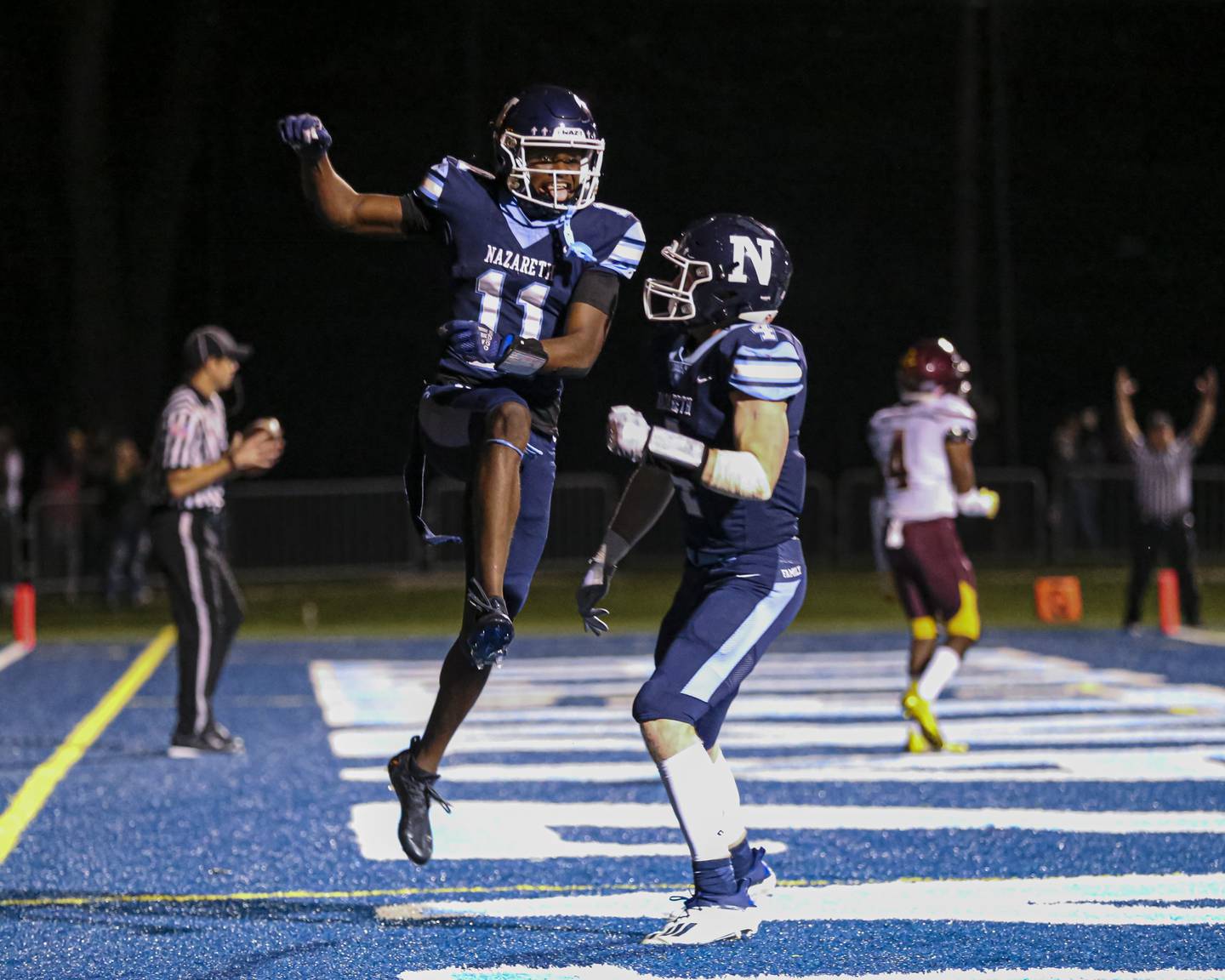 Nazareth Academy's Quentrell Harris (11) celebrates a touchdown reception during football game between Montini at Nazareth Academy Oct 15, 2021.