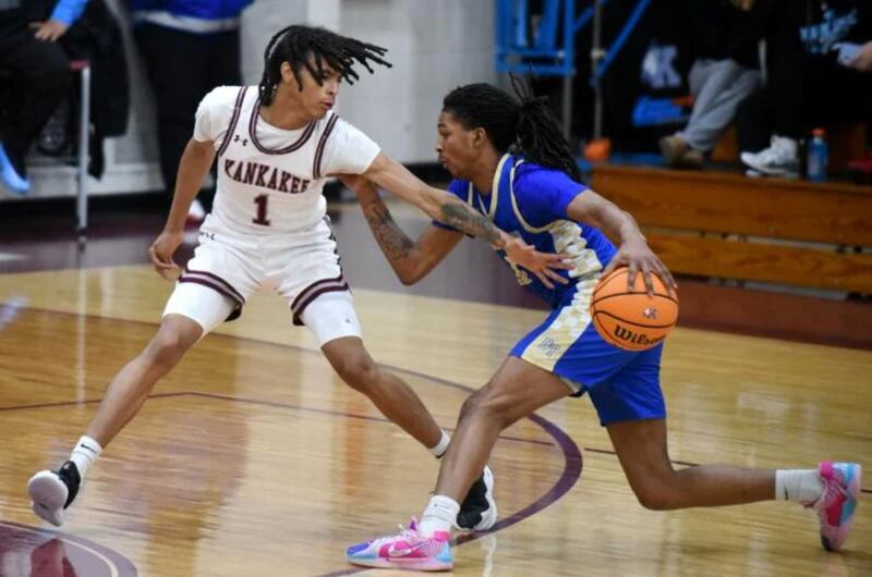 Kankakee's Lincoln Williams, left, defends Bloom's Payton Edwards during Tuesday's game at Kankakee.