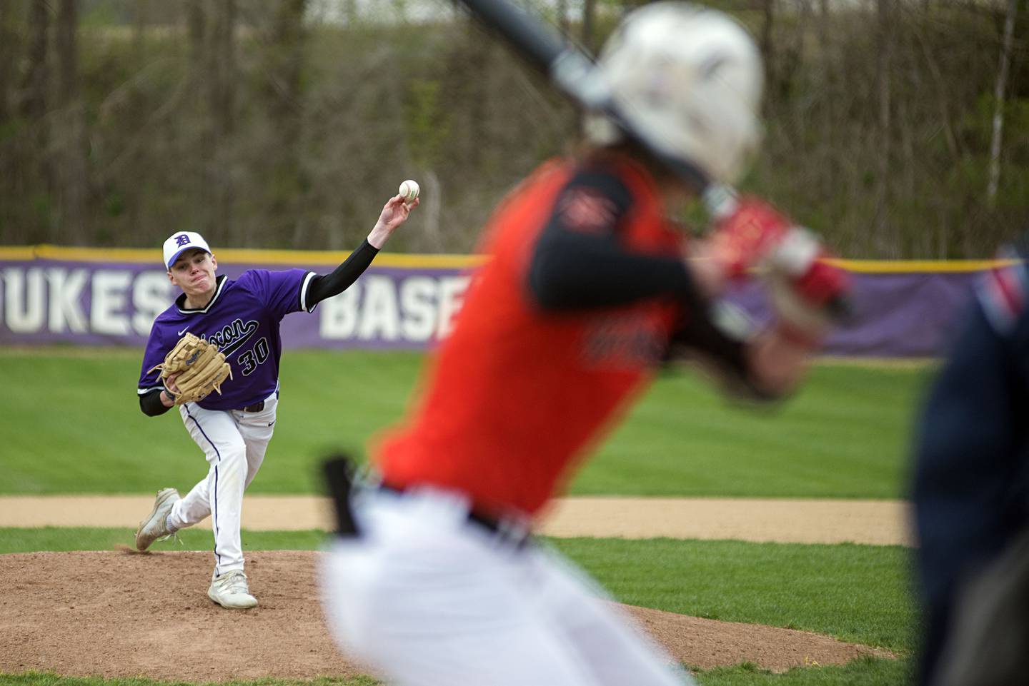 Dixon's Max Clark fires a pitch early in the game Wednesday, April 27, 2022 against Winnebago.