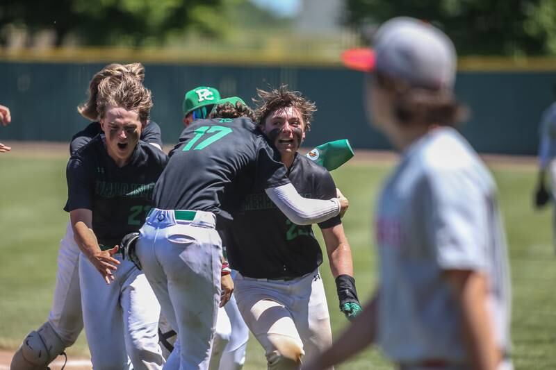 Providence celebrates on the field after defeating Homewood-Flossmoor in the 4A Providence Regional championship game Saturday, May 25, 2024.