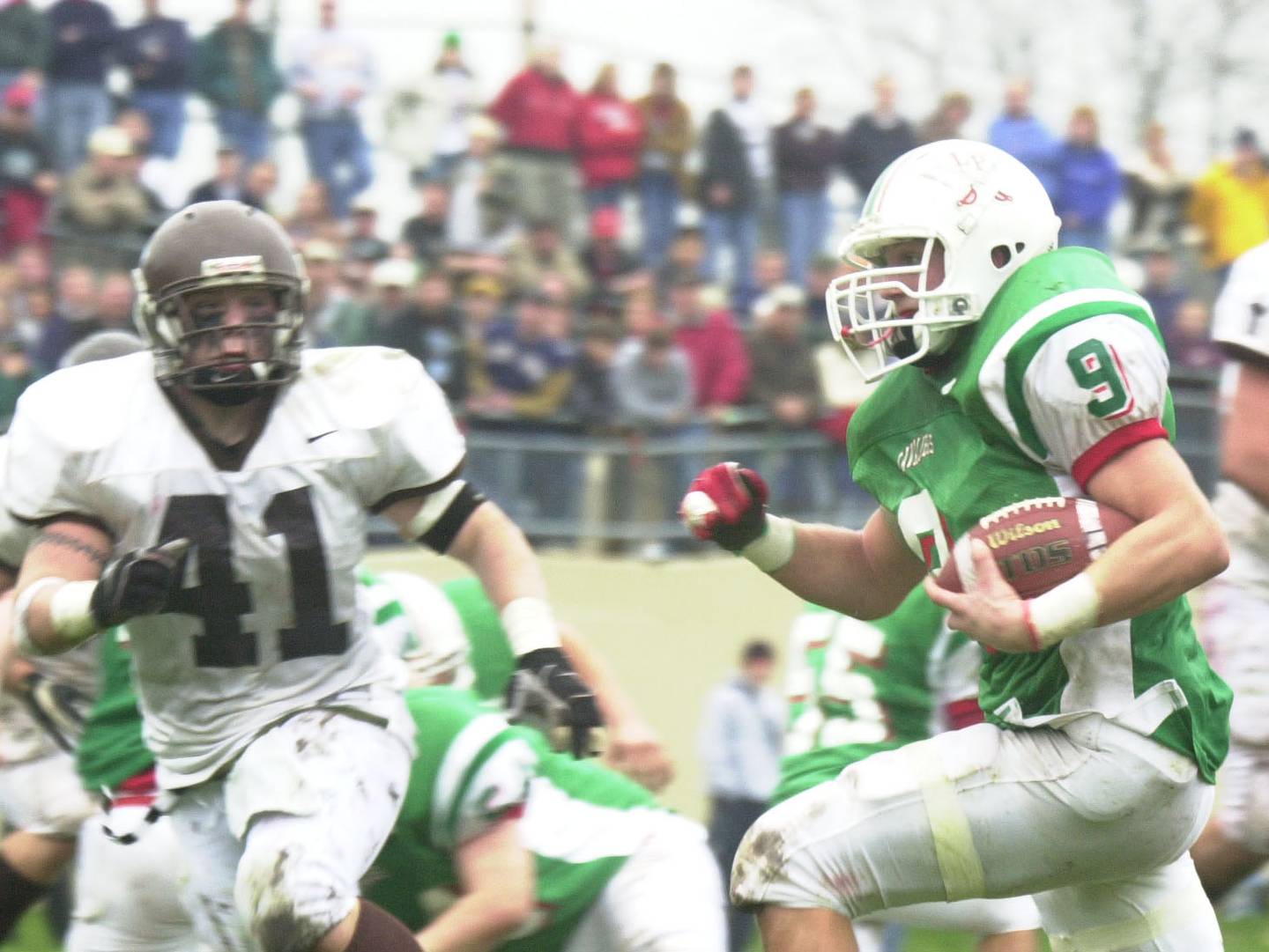 La Salle-Peru's Wes Kostellic (9) runs the ball against Joliet Catholic in a Class 5A semifinal in 2003.