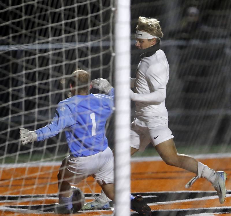 McHenry's Mason Bertone tries to get the ball away from Prairie Ridge's Gabriel Porter during a Fox Valley Conference soccer match on Tuesday, Oct. 15, 2024, at McCraken Field in McHenry.