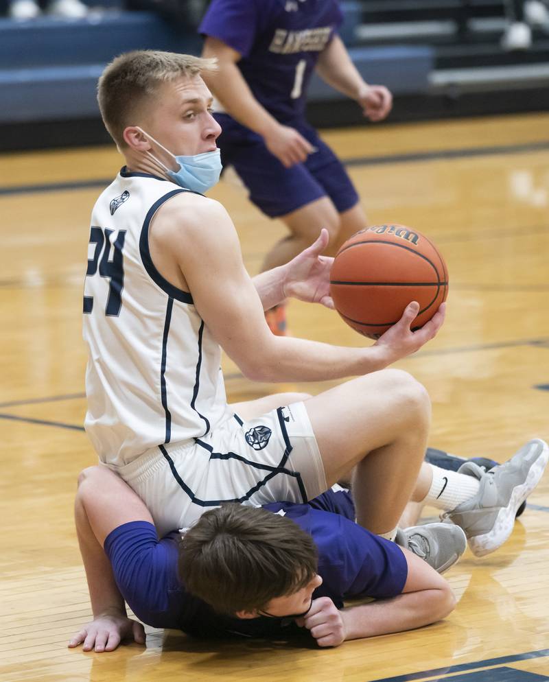 Cary-Grove's Ryan Zielinski lands on top of Hampshire's Sam Ptak during their game on Tuesday, January 25, 2022 at Cary-Grove High School in Cary.