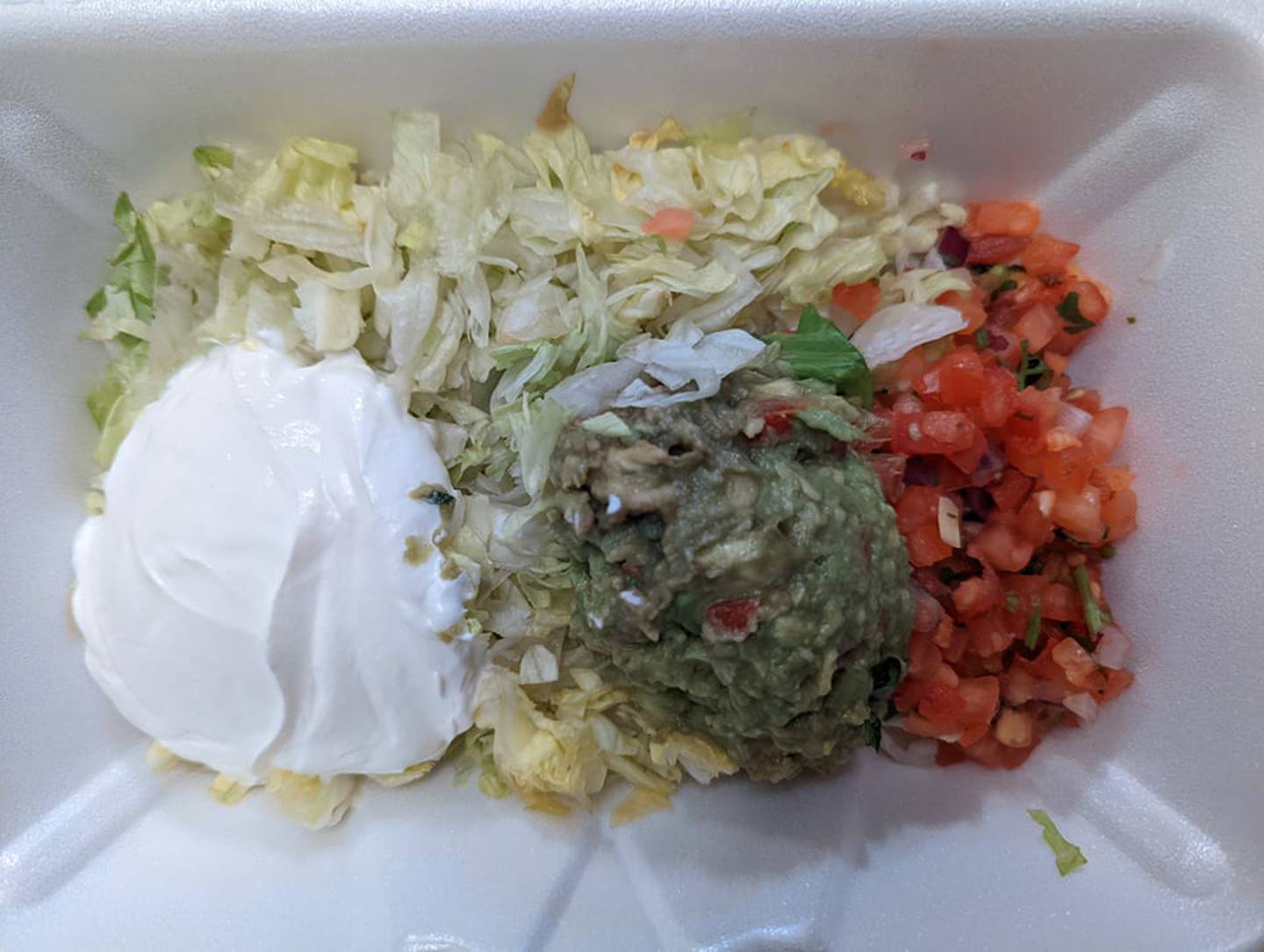 The Tex-Mex steak fajita meal on flour tortilla from Skooter's RoadHouse came with lettuce, tomatoes, guacamole and sour cream, along with rice and black beans.