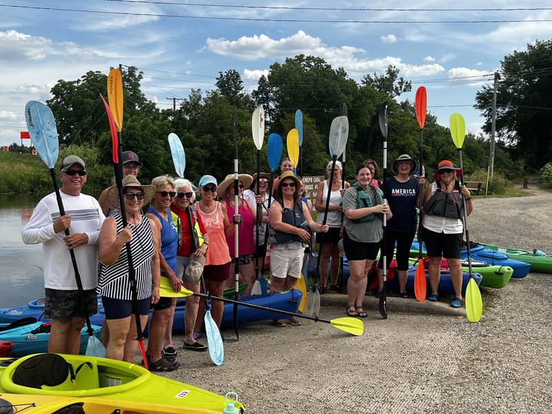 The Yak Yak Sisters gather at the Hennepin Canal for a photo during a kayak outing Wednesday.