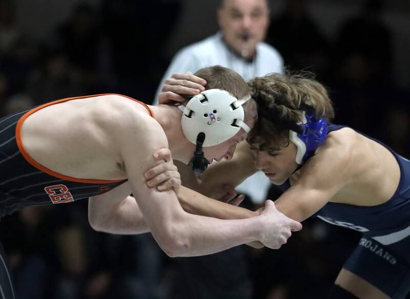 Crystal Lake Central’s Peyton Ramsey, left, battles Cary-Grove’s Henry Kos at 120 pounds in varsity wrestling Thursday, Dec. 19, 2024 at Cary-Grove High School in Cary.