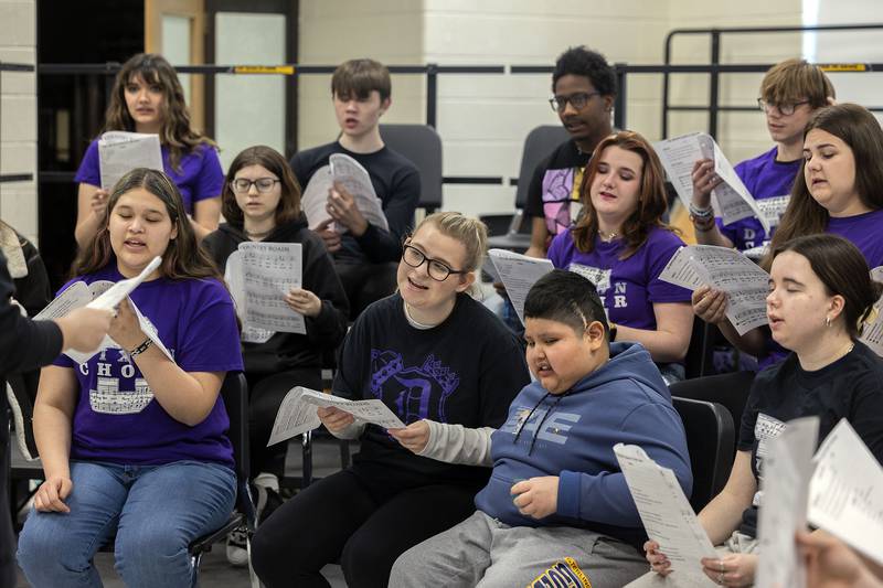 Choir members at Dixon High School rehearse Thursday, April 10, 2025, for their upcoming performance.