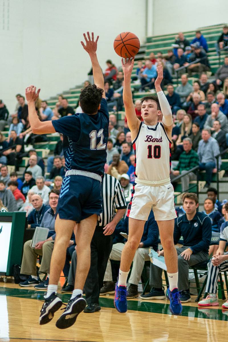 Benet’s Andy Nash (10) shoots a three-pointer against Lake Park's Joshua Gerber (12) during a Bartlett 4A Sectional semifinal boys basketball game at Bartlett High School on Tuesday, Feb 28, 2023.