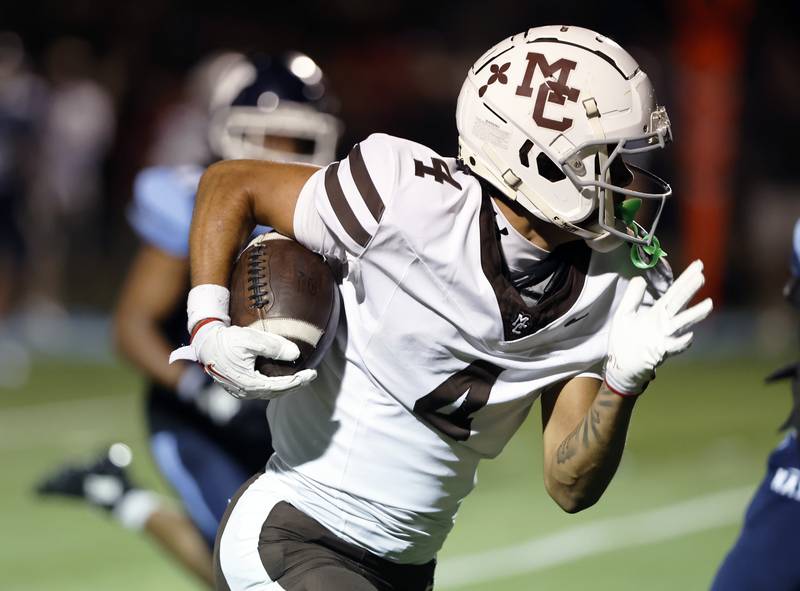 Mt. Carmel's Quentin Burrell (4) runs during the varsity football game between Mt. Carmel high school and Nazareth Academy on Friday, Sept. 12, 2025 in La Grange Park, IL.