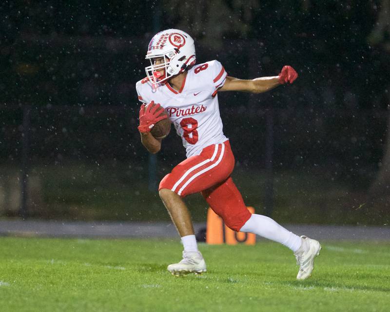 Ottawa's Bryson Valdezruns the ball for a gain against Kaneland on Friday, Sept. 19, 2025 in Maple Park.