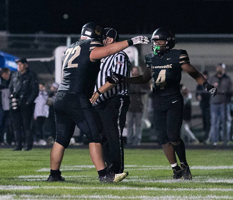 Sycamore's Tyler Curtis (4) is greeted by Lincoln Cooley (72) after scoring a touchdown against Kaneland during a football game at Kaneland High School in Maple Park on Friday, Sep 30, 2022.