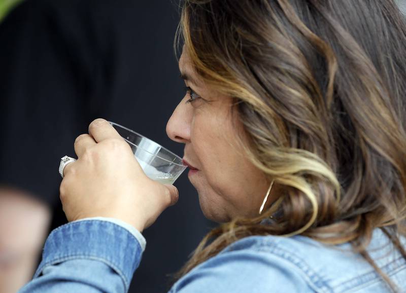 Cynthia DeLuna of Oswego enjoys a sip of wine at the Festival of the Vine Friday September 8, 2023 in Geneva.